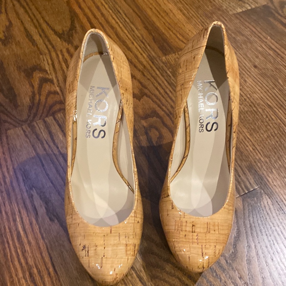 Used shiny cork style Michael Kors heels. Size 7. Box no dust bag.